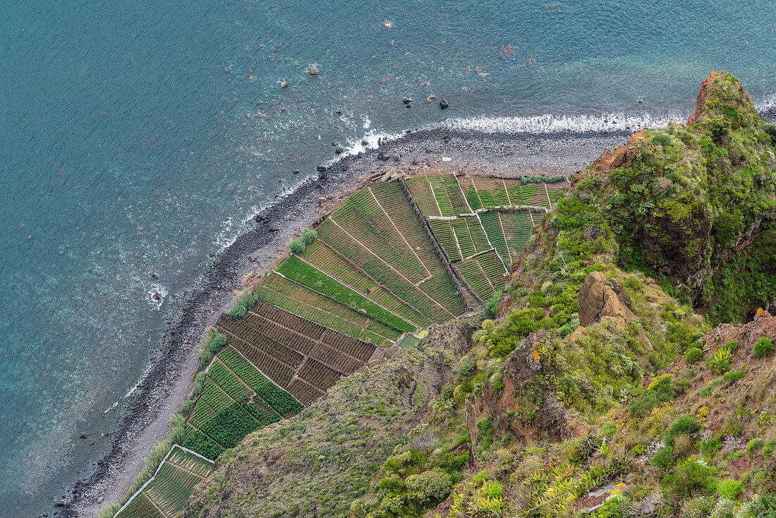 Plantations and Atlantic Ocean from Cabo Girao skywalk and viewpoint. Camara de Lobos, Madeira region, Portugal.