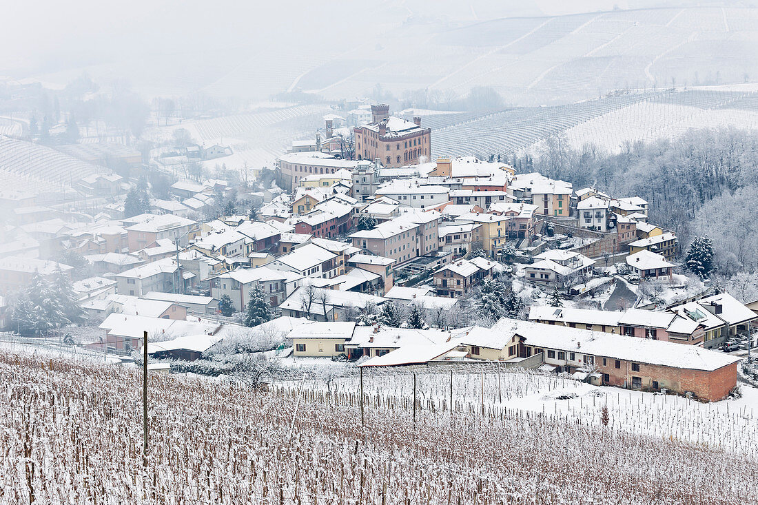 Langhe, Cuneo district, Piedmont, Italy. Langhe wine region winter snow, Barolo castle
