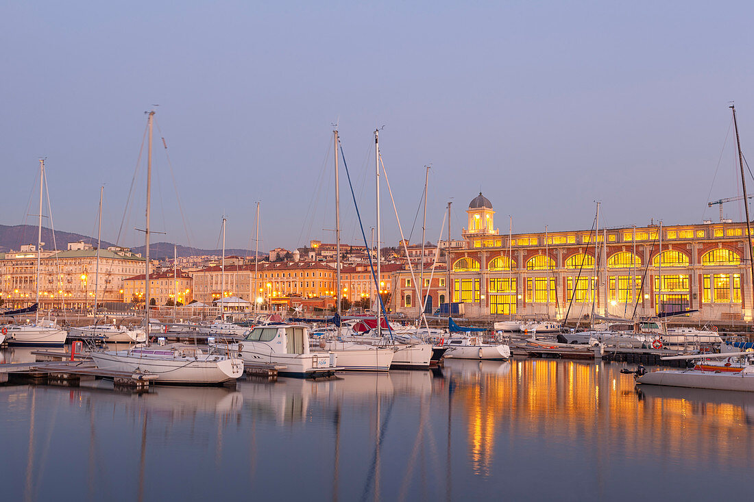 "Dusk on the port of Trieste, with the palace called ""Salone degli Incanti"" (Enchantments Hall). Trieste, Friuli-Venezia Giulia, Italy"