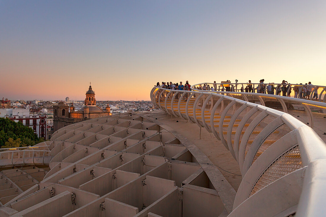 Tourists on the upper level of Metropol Parasol at sunset, Seville, province of Seville, Andalusia, Spain