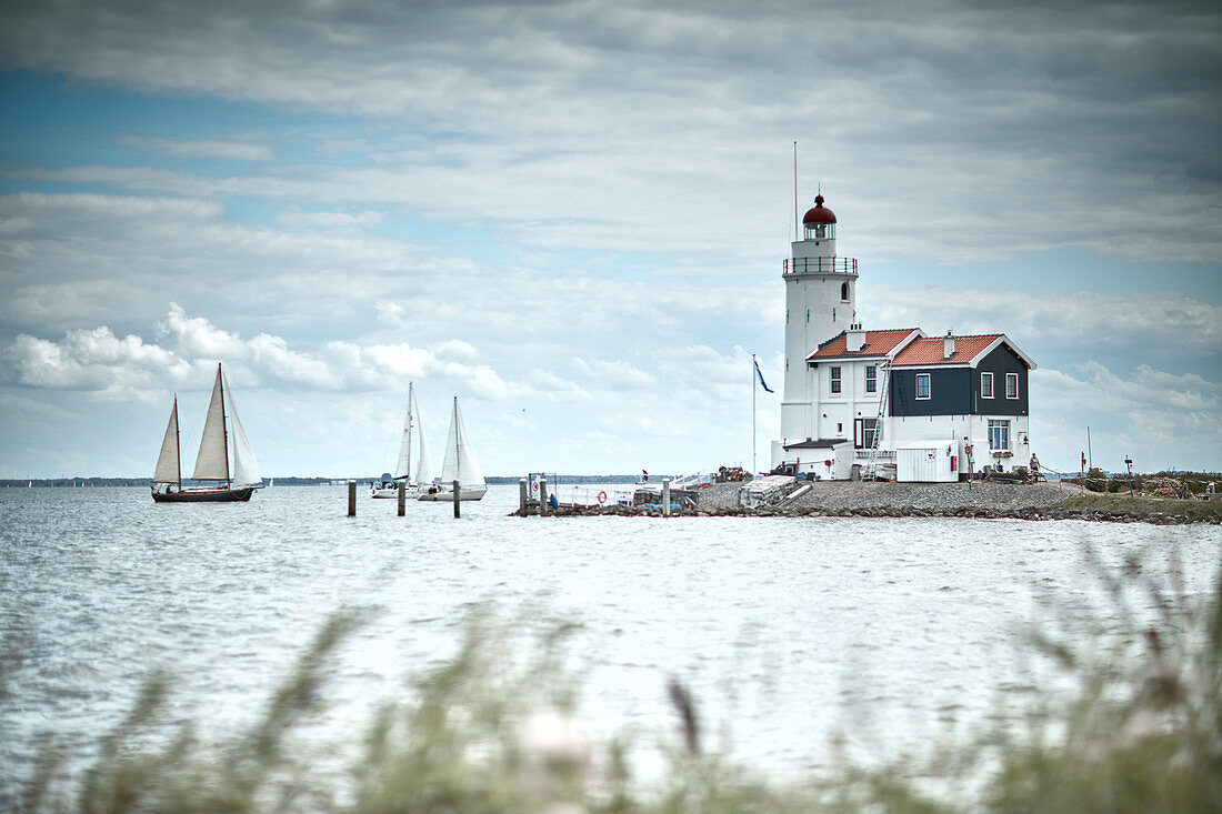 Lighthouse and sailboats, Marche island, Netherlands