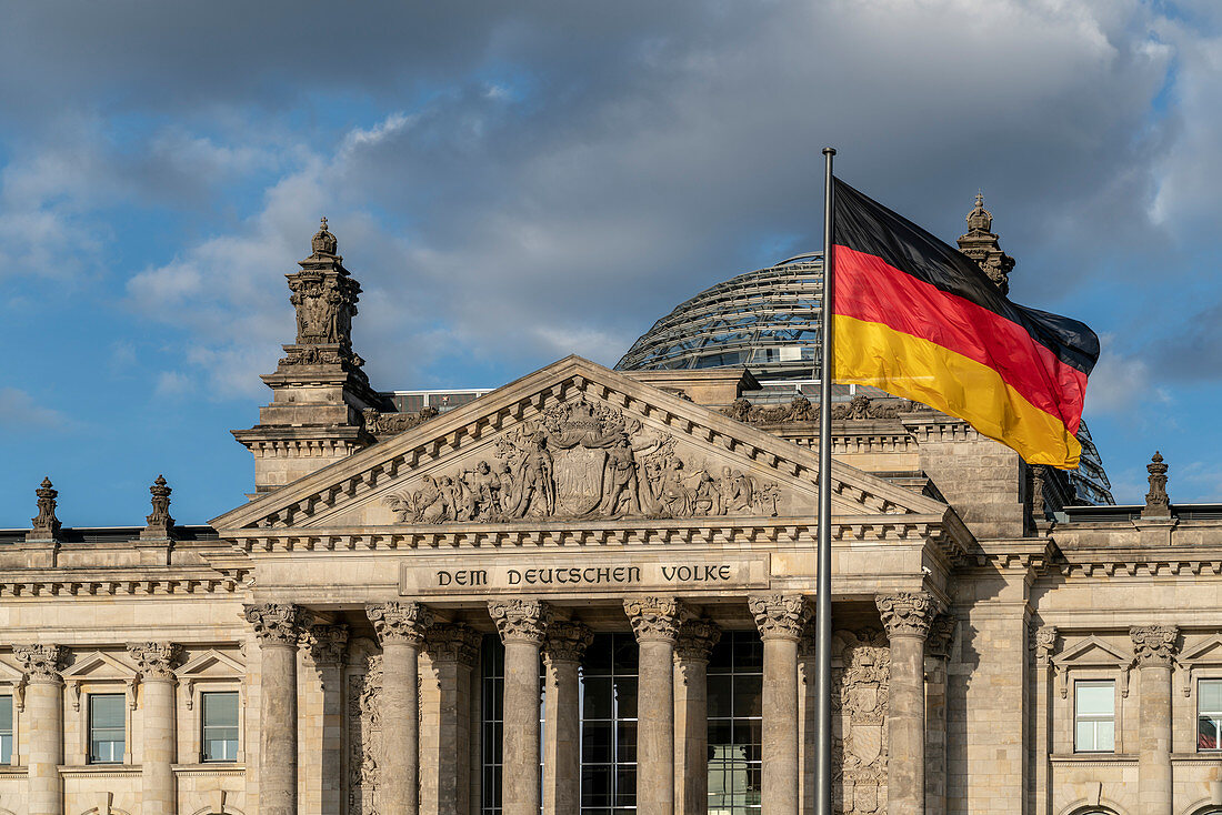 The Reichstag of Berlin with German flag, Berlin