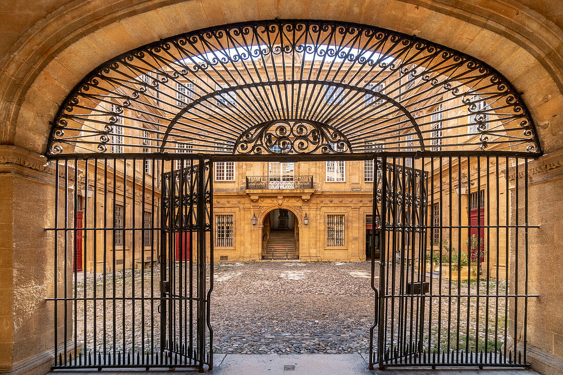 Wrought-iron gate to the courtyard of the town hall of Aix en Provence, France