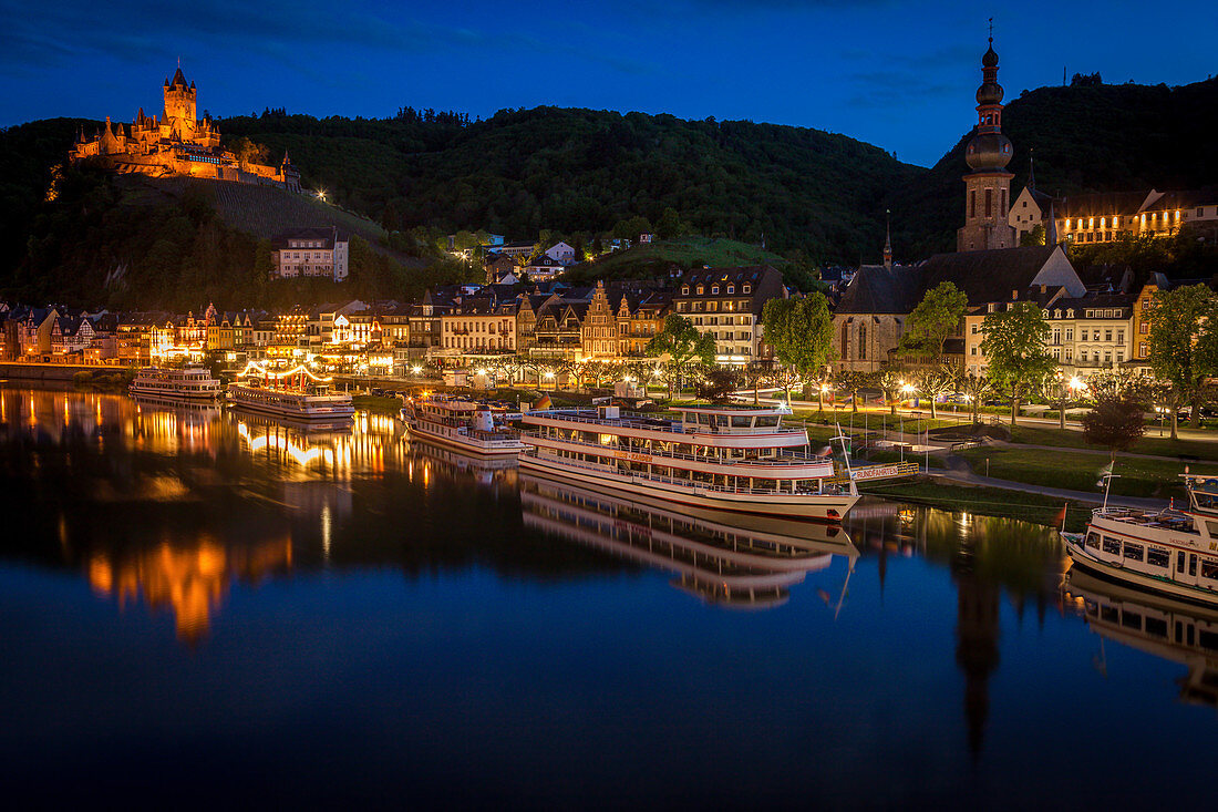 Town and Cochem Imperial Castle by river at sunset in Cochem, Germany