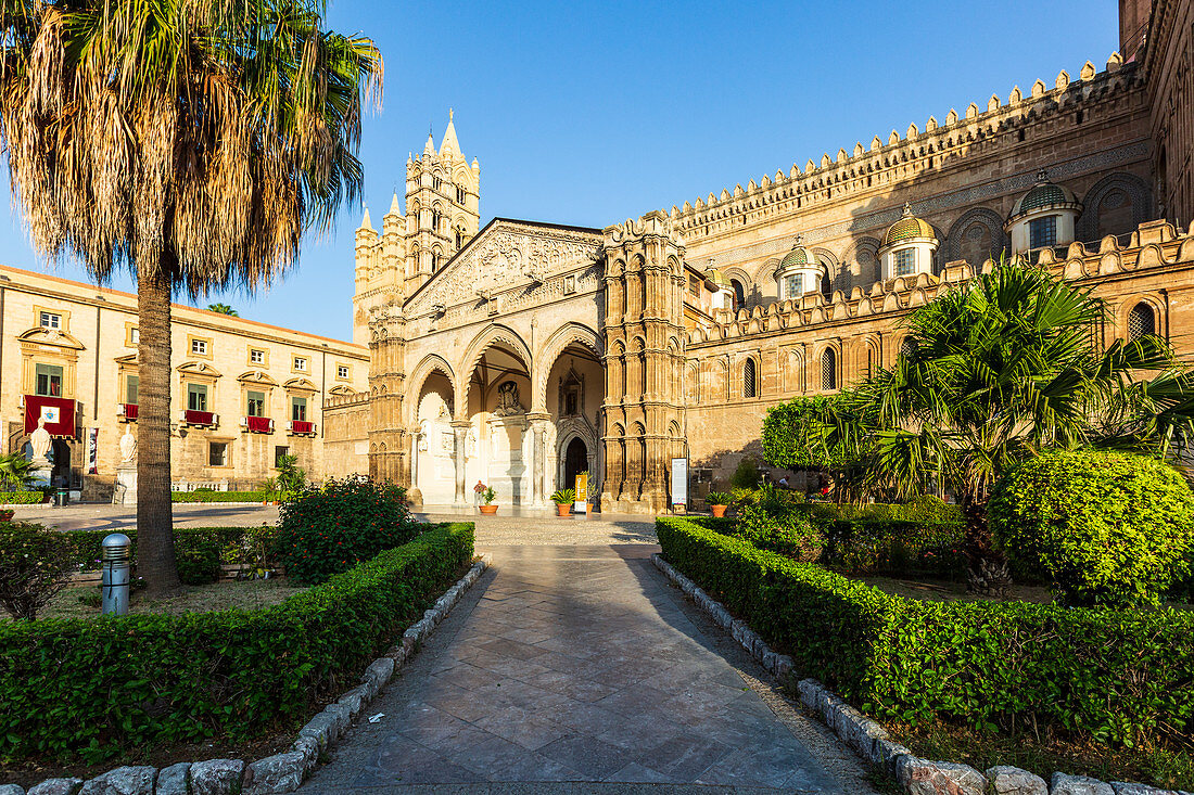 The Cathedral of Palermo with the well-kept garden in the foreground