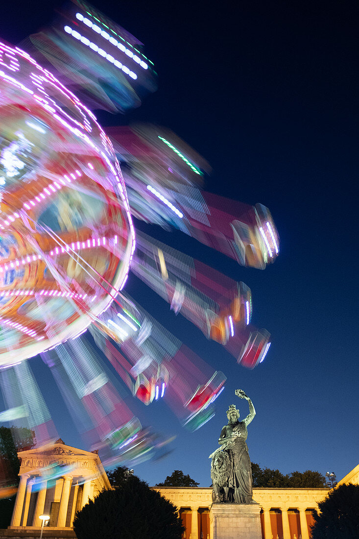 Carousel in front of the Bavaria at the blue hour, Oktoberfest, Munich, Bavaria, Germany