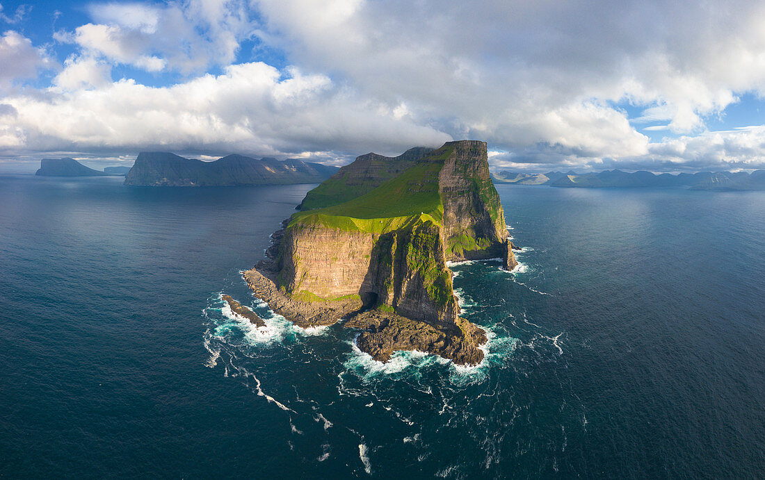 Aerial panoramic of Kallur lighthouse and cliffs, Kalsoy island, Faroe Islands, Denmark, Europe
