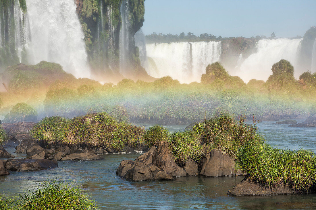 Scenic view of rainbow†at bottom of splashing Iguazu Falls, Parana, Brazil