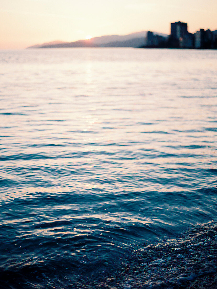 Tranquil scene with view of water in sea at sunset, Vancouver, British Columbia, Canada
