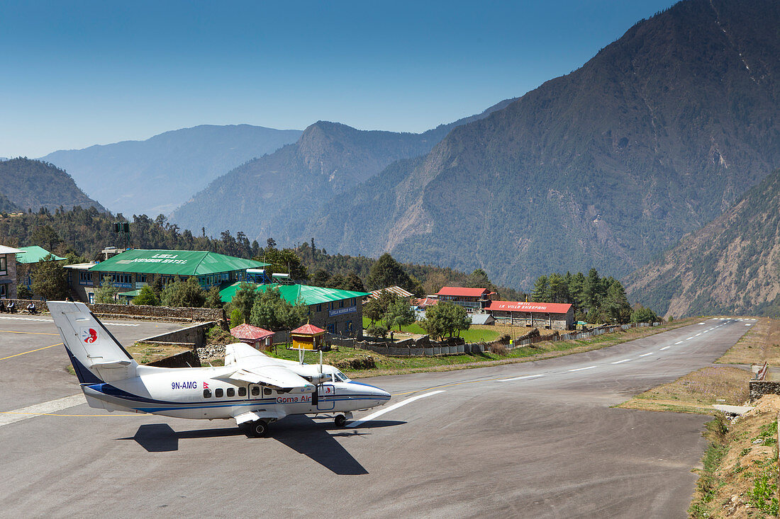 A small airplane is taking off from the famous airport of Lukla in the Nepalese Himalaya. The trek to Everest Base Camp (EBC) is possibly the most dramatic and picturesque in the Nepalese Himalaya. Not only will you stand face to face with Mount Everest, Sagarmatha in Nepali language, at 8,848 m (29,029 ft), but you will be following in the footsteps of great mountaineers like Edmund Hillary and Tenzing Norgay. The trek is scenic and offers ever-changing Himalayan scenery through forests, hills and quaint villages. A great sense of anticipation builds as you trek up the Khumbu Valley, passing 