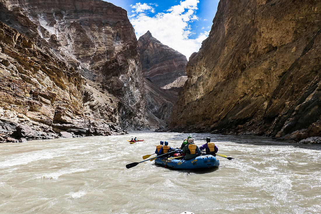 Adventurous people rafting in Zanskar River gorge, Ladakh Region, Jammu and Kashmir, India