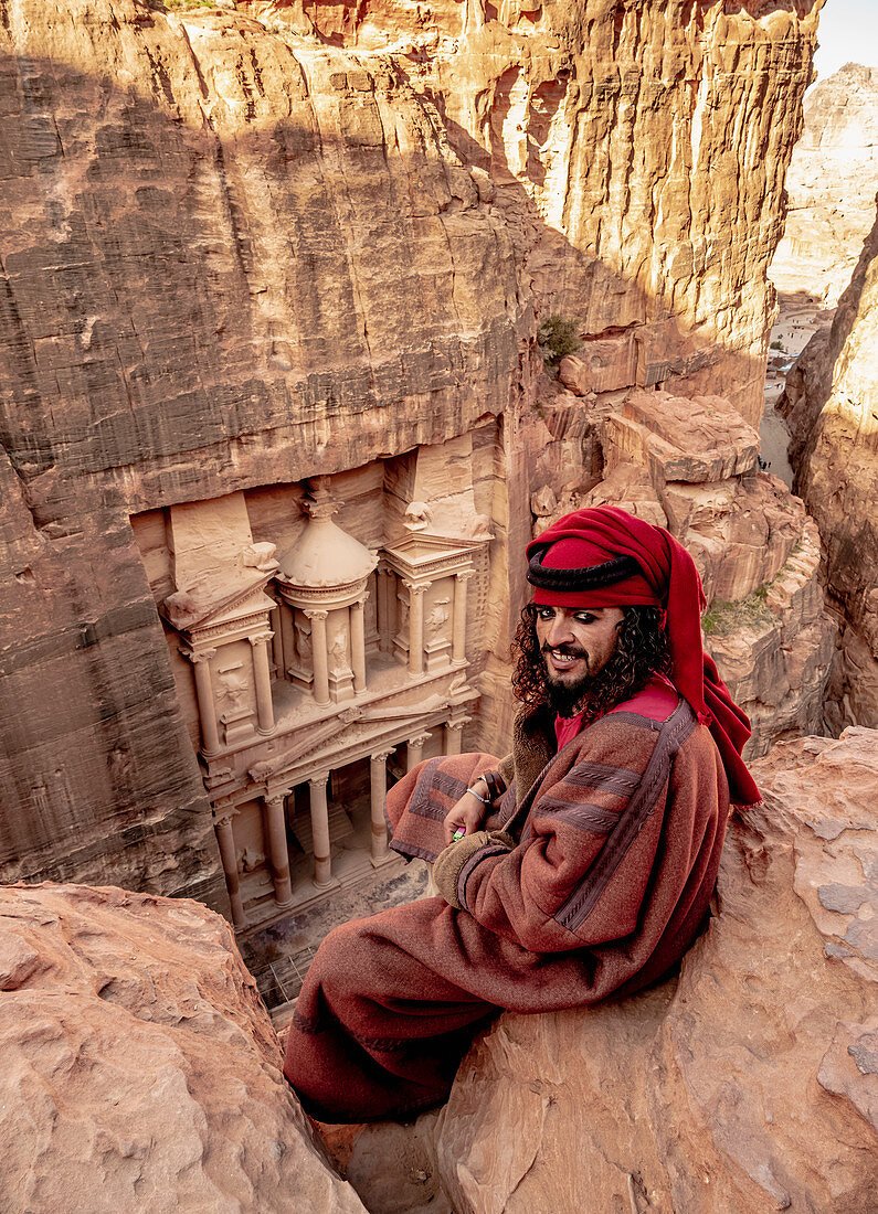 Bedouin man at The Treasury view point, Petra The Monastery (Ad-Deir), Petra, UNESCO World Heritage Site, Ma'an Governorate, Jordan, Middle East