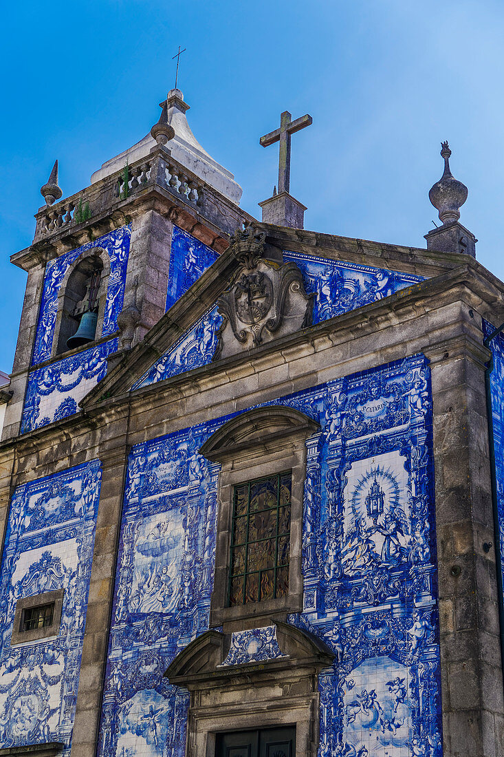 Facade of Chapel of Souls, covered with azulejo blue and white painted ceramic tiles, Capela das Almas Church, Porto, Portugal, Europe