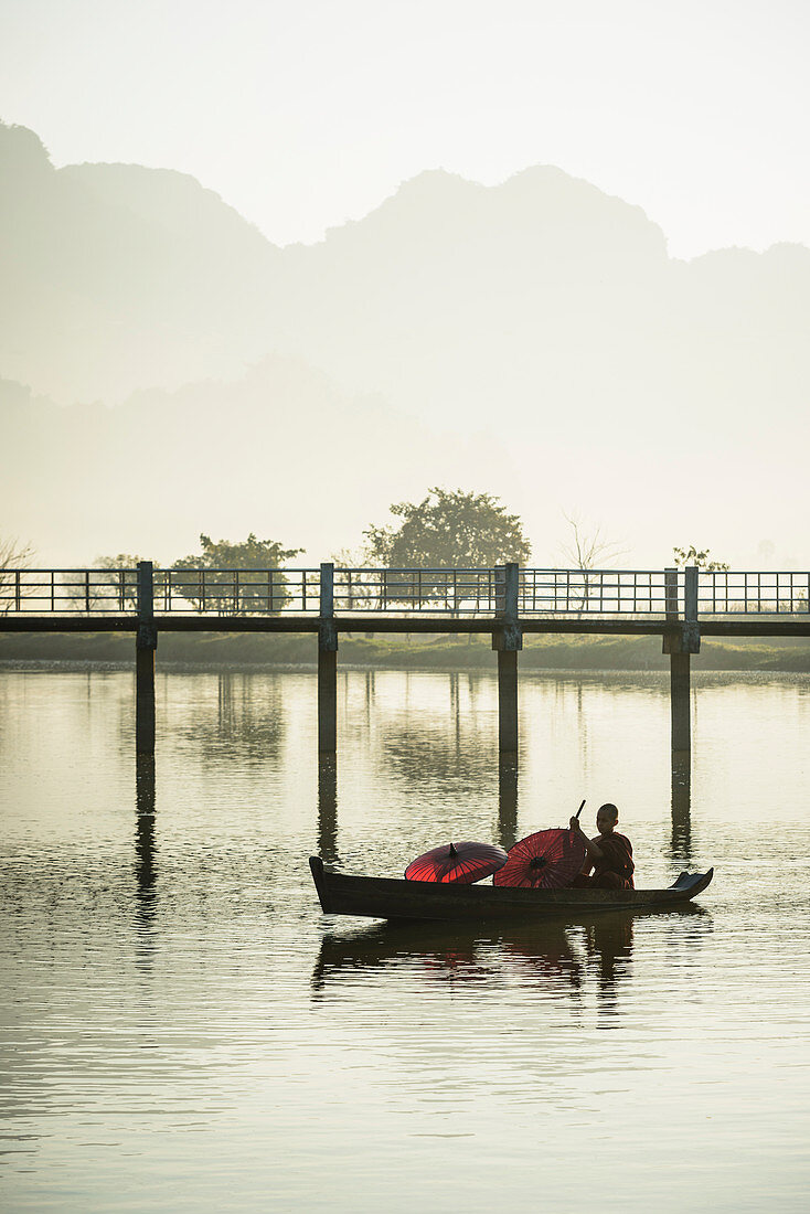 Mountains and bridge reflected in still lake, Hpa an, Kayin, Myanmar