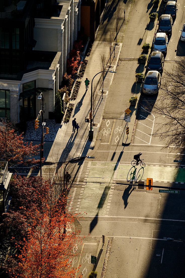 High angle view of bicyclist in city intersection, Vancouver, British Columbia, Canada