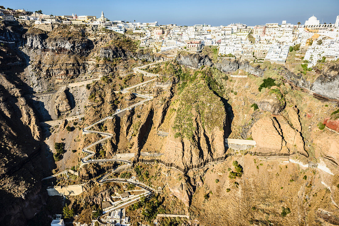 Aerial view of city built on rocky hilltop, Oia, Egeo, Greece