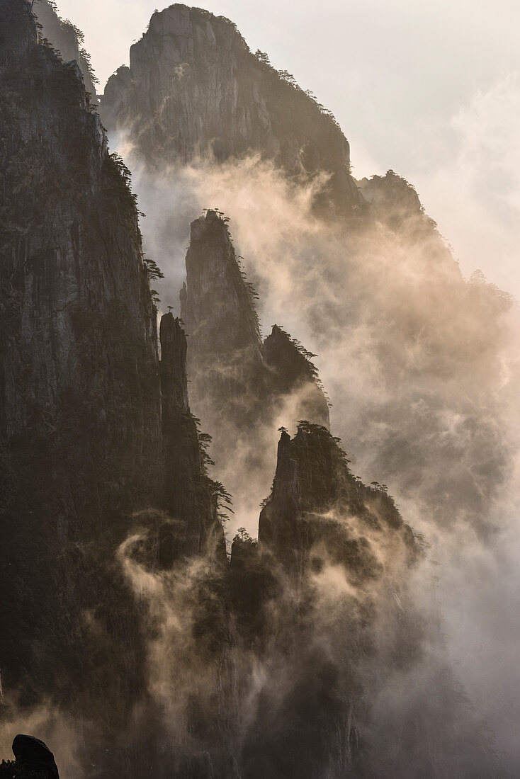 Fog rolling over mountains, Huangshan, Anhui, China,