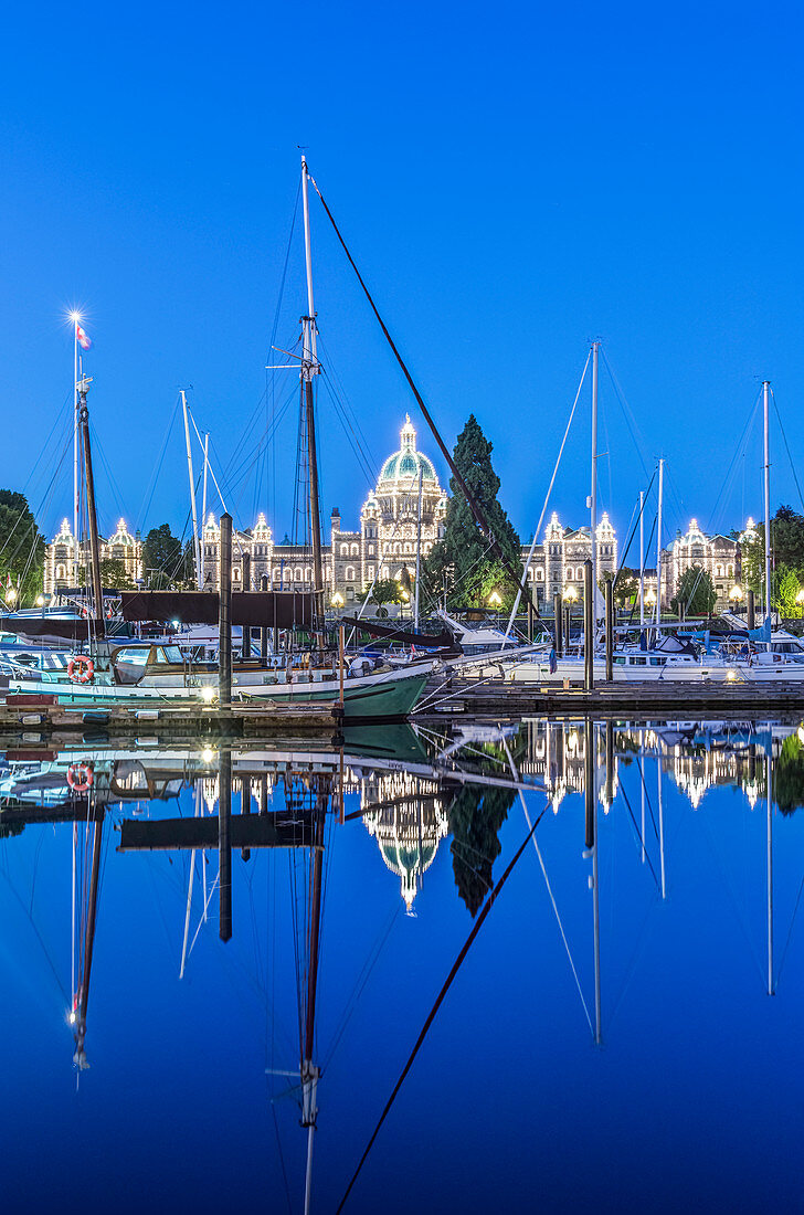 Parliament Buildings and harbor illuminated at dawn, Victoria, British Columbia, Canada