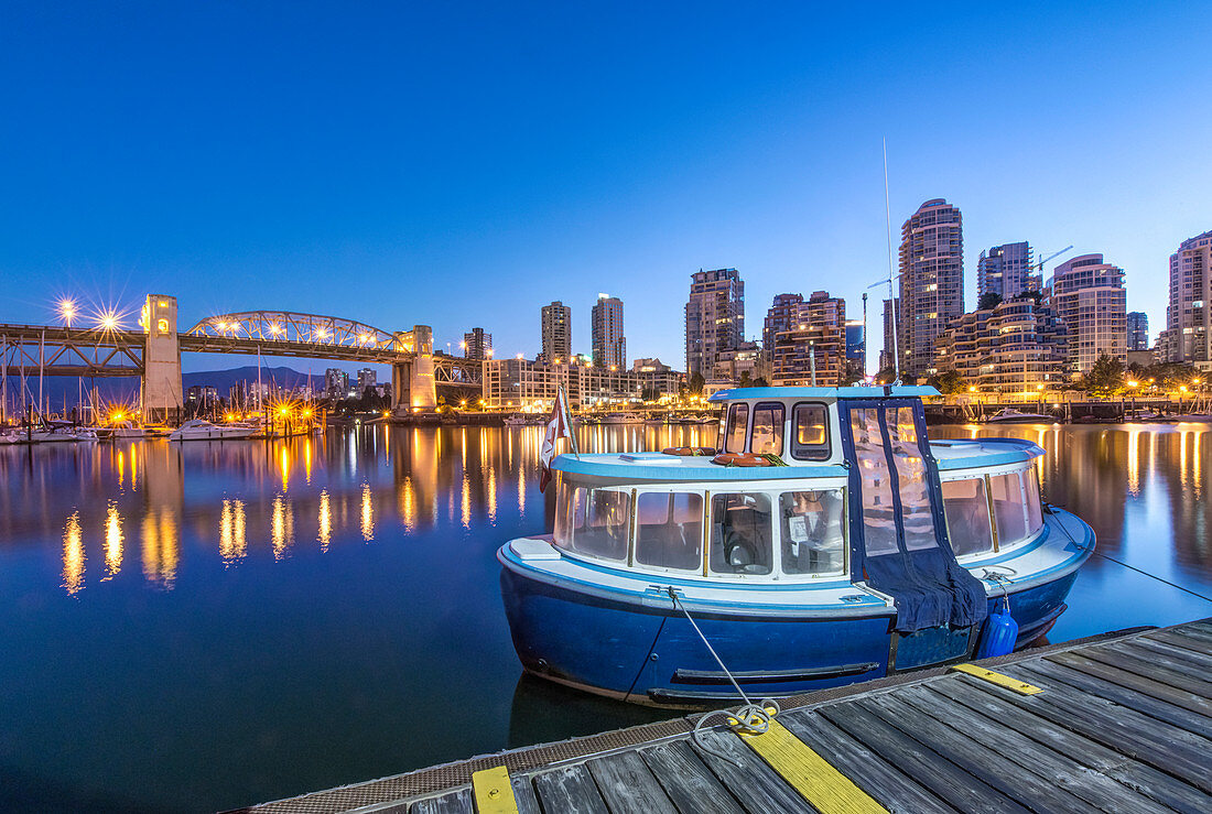 Waterfront skyline and harbor illuminated at night, Vancouver, British Columbia, Canada