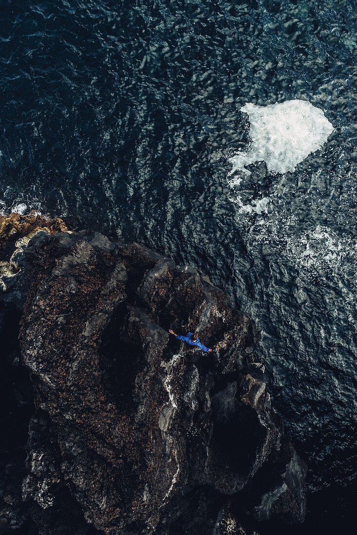 Man stands on a cliff on the island Pico, Pico, Azores, Portugal, Atlantic, Europe