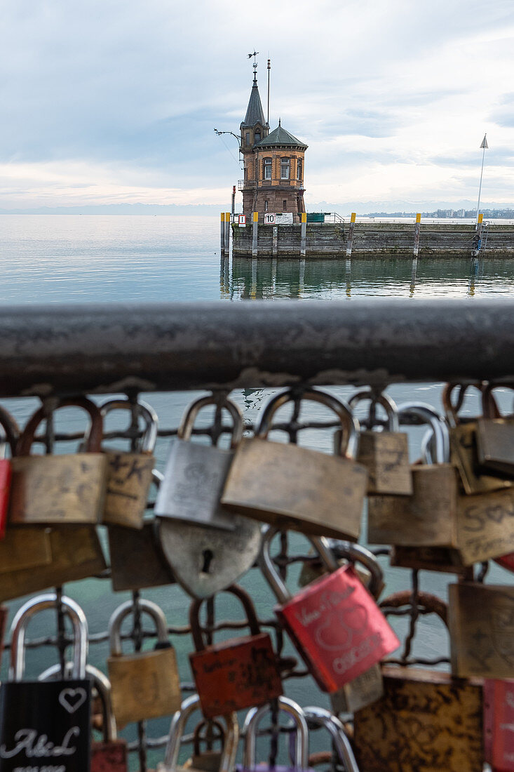 View of the south jetty lighthouse with love locks in the foreground, Constance harbor, Baden-Württemberg, Germany