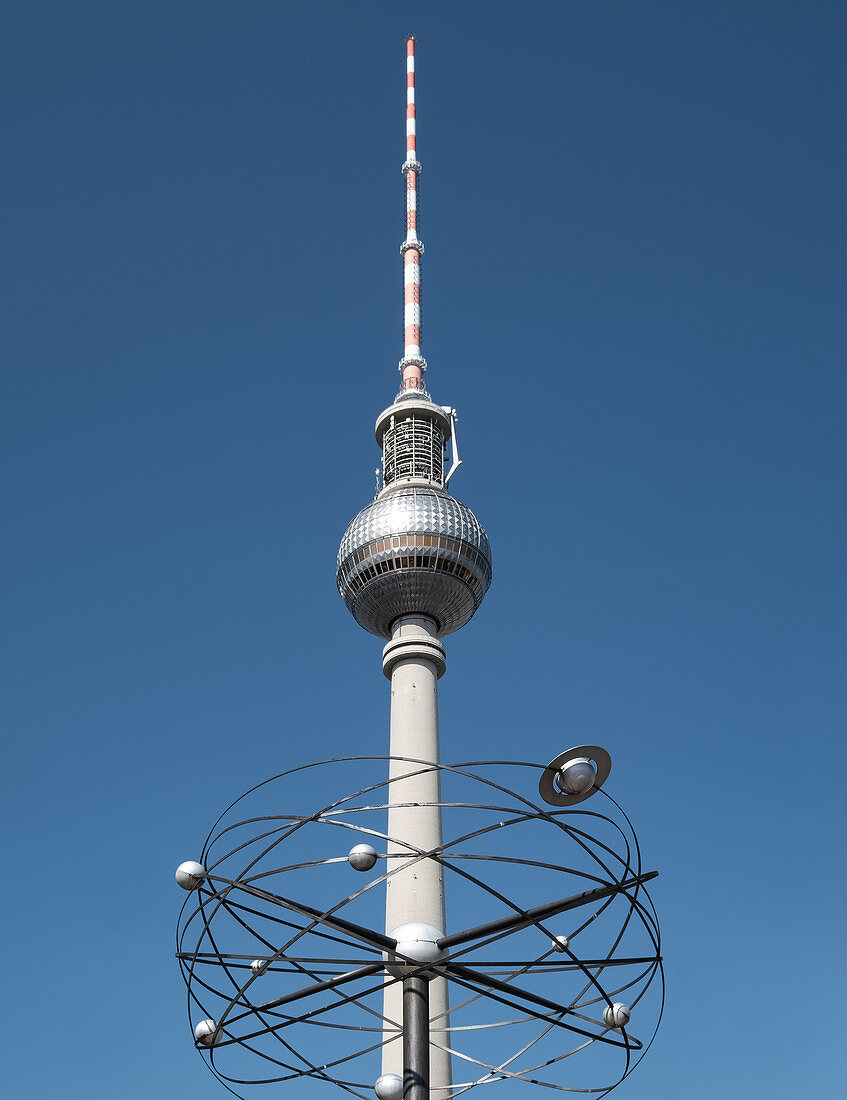 View of the television tower in the foreground with the world clock in the same axis, Alexanderplatz, Mitte, Berlin, Germany