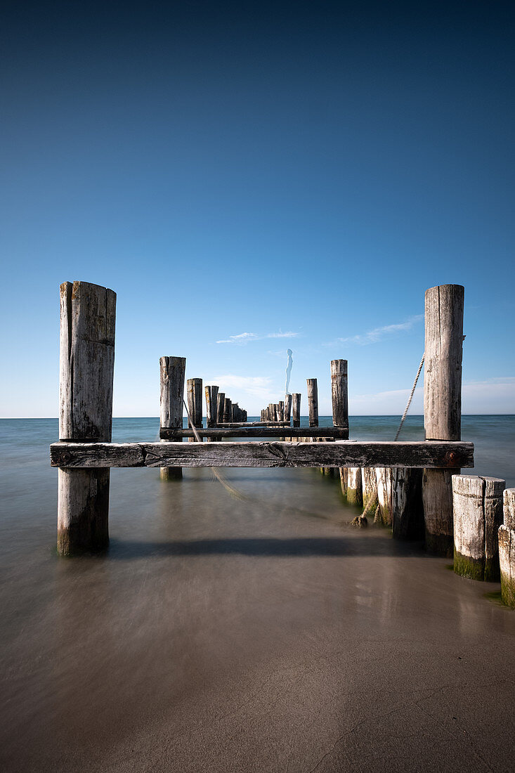 View of the old wooden footbridge on the Baltic Sea beach of Zingst, Mecklenburg-West Pomerania, Germany