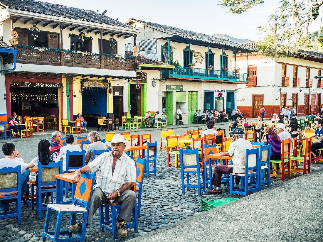 Patrons relax at cafe tables, Parque Principal, Jardin, Antioquia, Colombia, South America