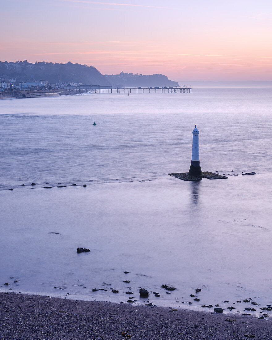 Early morning looking to Teignmouth with the Navigation mark at the entrance to the River Teign, viewed from Shaldon, Devon, England, United Kingdom, Europe