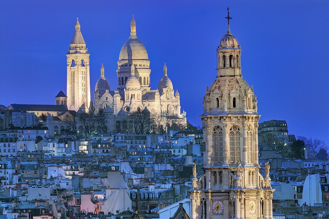 France, Paris, the basilica of the Sacré-Coeur of Montmartre and the bell-tower of Sainte-Trinité (Holy Trinity) church