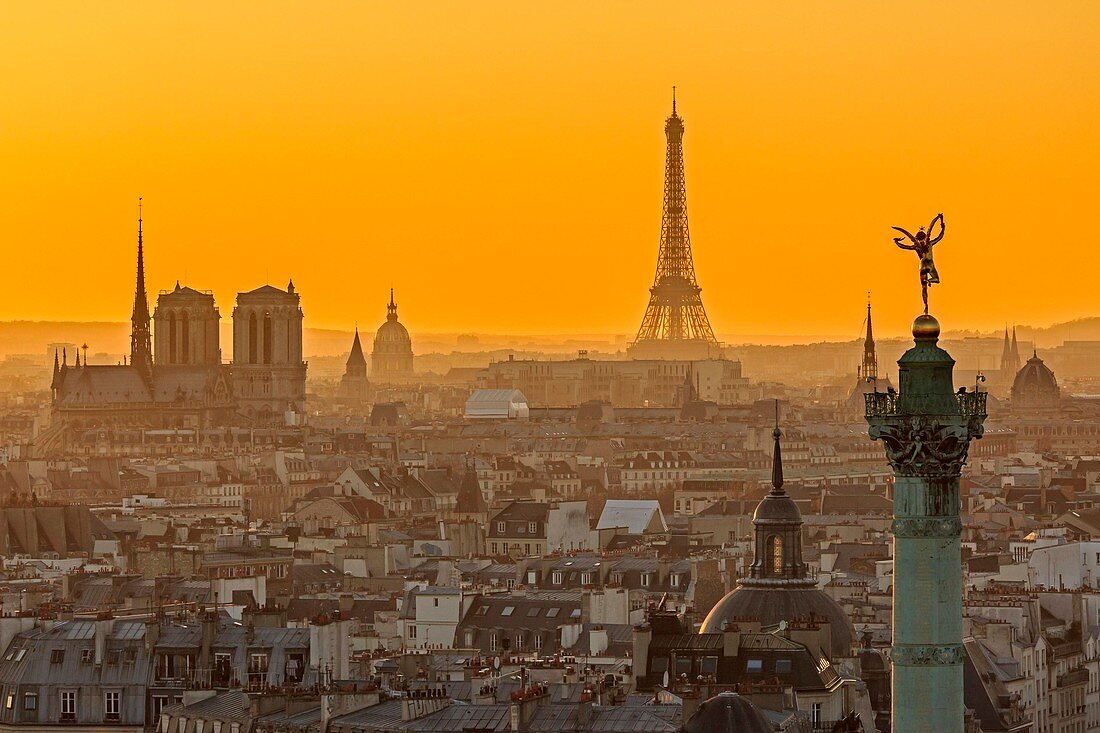 France, Paris, area listed as World Heritage by UNESCO, general view of Paris at sunset with the July Column (Colonne de Juillet) at Place de la Bastille, the Notre Dame cathedral on the Ile de la Cite, the Eiffel Tower, the Invalides dome and the Saint Germain des Pres church