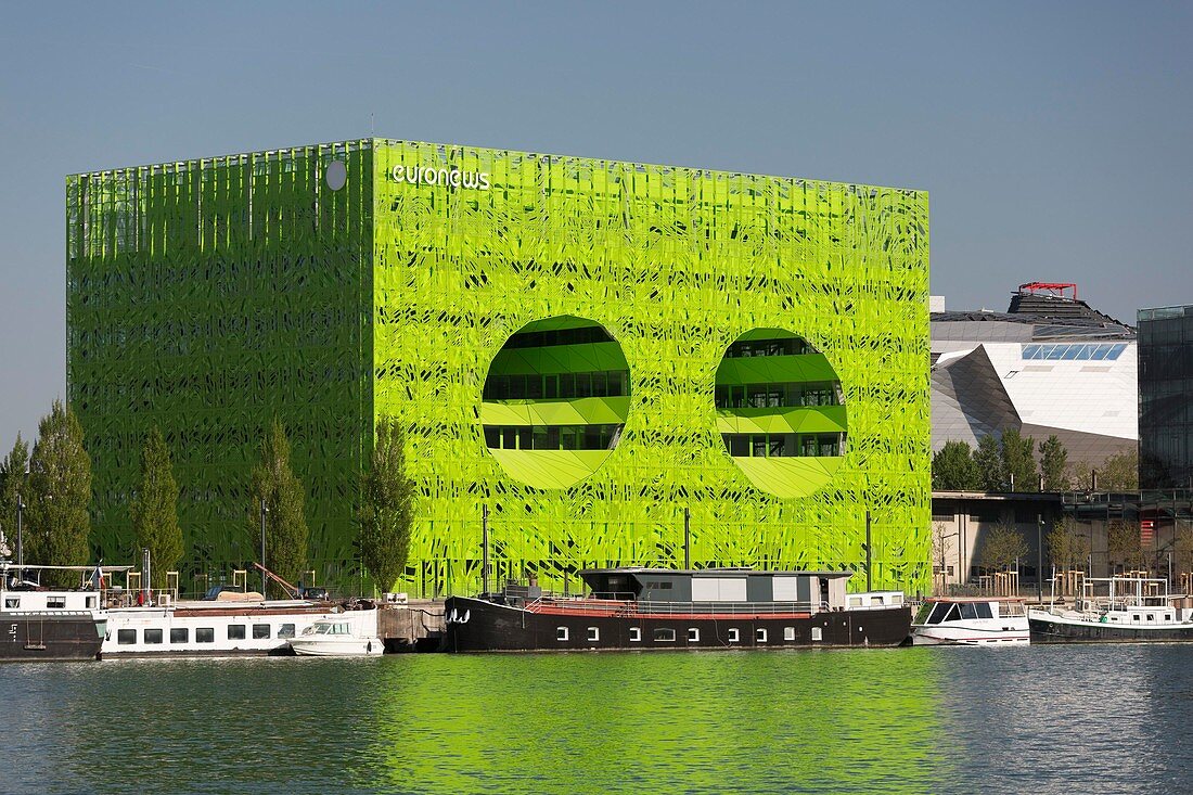 France, Rhone, Lyon, La Confluence new district in the South of the Presqu'ile (Peninsula), the green building of Euronews headquarters by architects Dominique Jakob and Brendan Mac Farlane on the old site of Port Rambaud