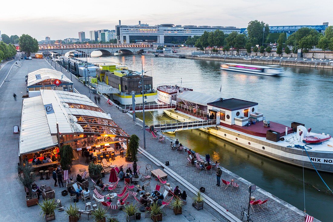 France, Paris, area listed as World Heritage by UNESCO, the banks of the Seine Quai Francois Mauriac, restaurants and barges on the Seine