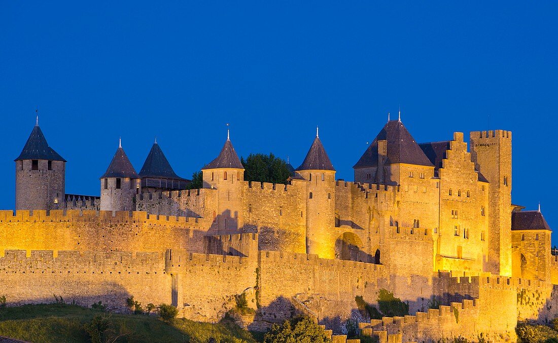 France, Aude, Carcassonne, medieval city listed as World Heritage by UNESCO, the ramparts on the western side by Porte d'Aude (Aude Gate)