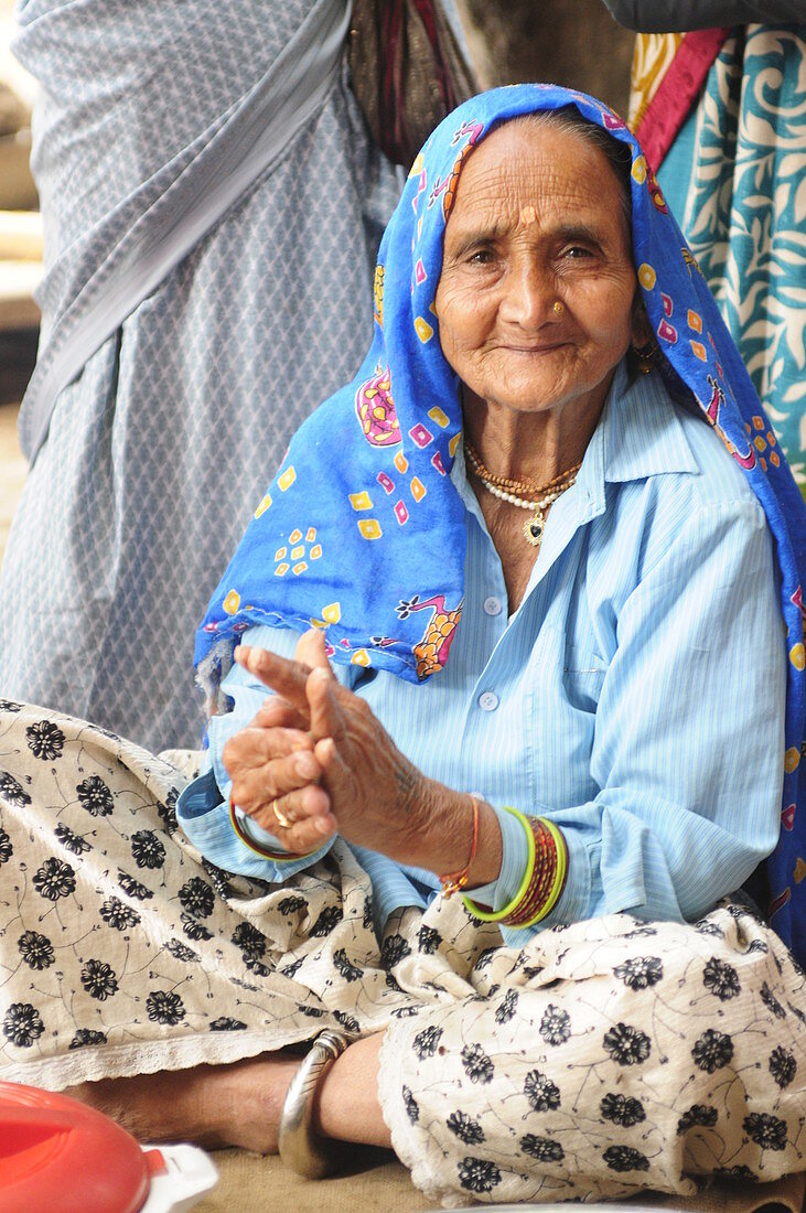 2015, Nandgoan / Nandagram, Vrindavan, Uttar Pradesh, India, Elderly woman making music at school event