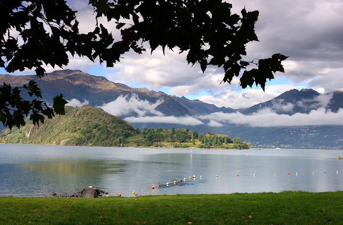 Clouds hang in the mountains on Abbazia di Piona, east side, Lake Como, Lombardy, Italy