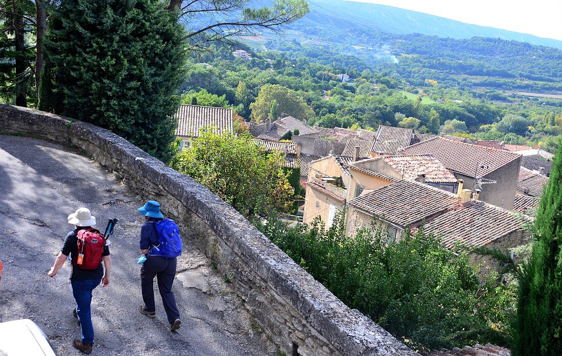 View from the upper town with hikers, Bonnieux in the Luberon, Provence, France