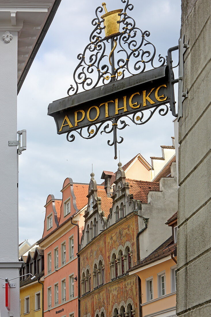 Pharmacy sign and town hall, in the old town of Konstanz, Baden-Württemberg, Germany