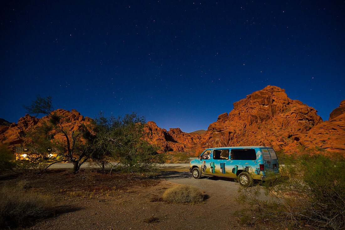 Camping Van at night with a starry sky in the Valley of Fire, USA