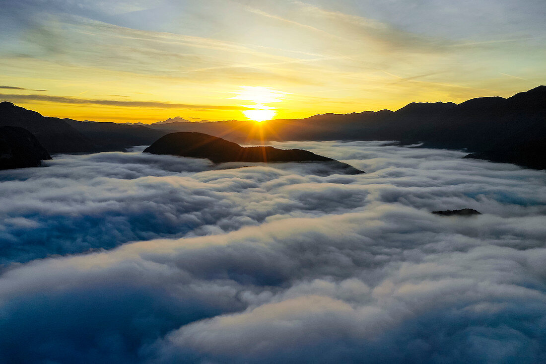 Heavy early morning fog over Bohinje Lake, Triglav National Park, Slovenia