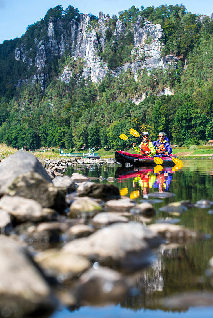 Kayaking on the Elbe, in the background the Bastei, Germany