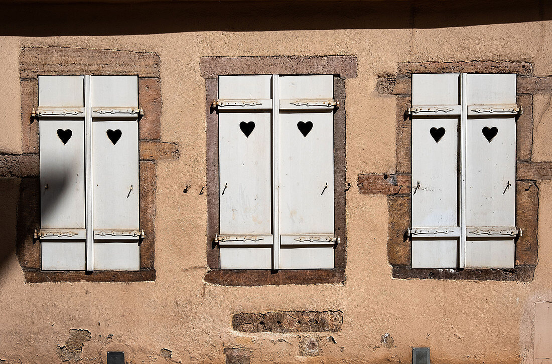 Shutters in half-timbered house in Eguisheim in Alsace, France, Europe