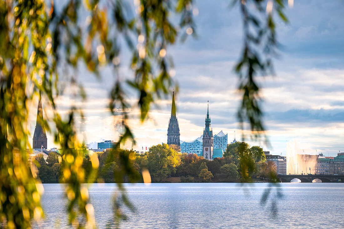 View over the Aussenalster to the town hall, the St. Nikolai memorial and the Elbphilharmonie in Hamburg, northern Germany, Germany