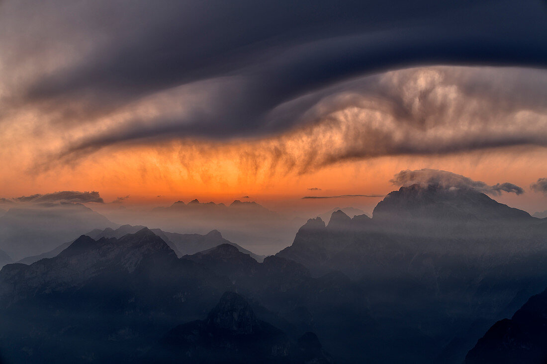 Clouds move over Monte Cornaget and Col Nudo, Monte Serva, Schiara, Bellunesian Dolomites National Park, Dolomites, UNESCO World Heritage Dolomites, Veneto, Italy