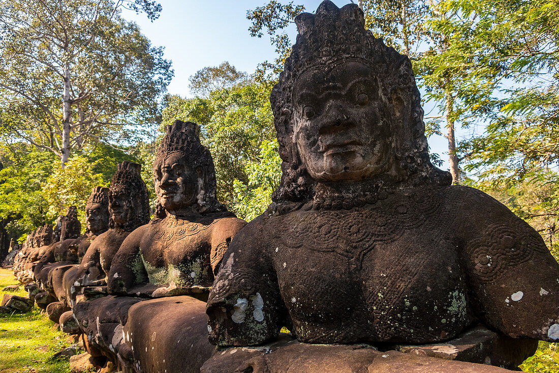 Statues at the entrance to Angkor Thom, Cambodia