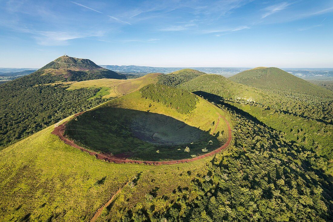 France, Puy de Dome, area listed as World Heritage by UNESCO, the Regional Natural Park of the Volcanoes of Auvergne, Chaine des Puys, Orcines, the crater of Puy Pariou volcano, the Puy de Dome volcano in the background (aerial view)
