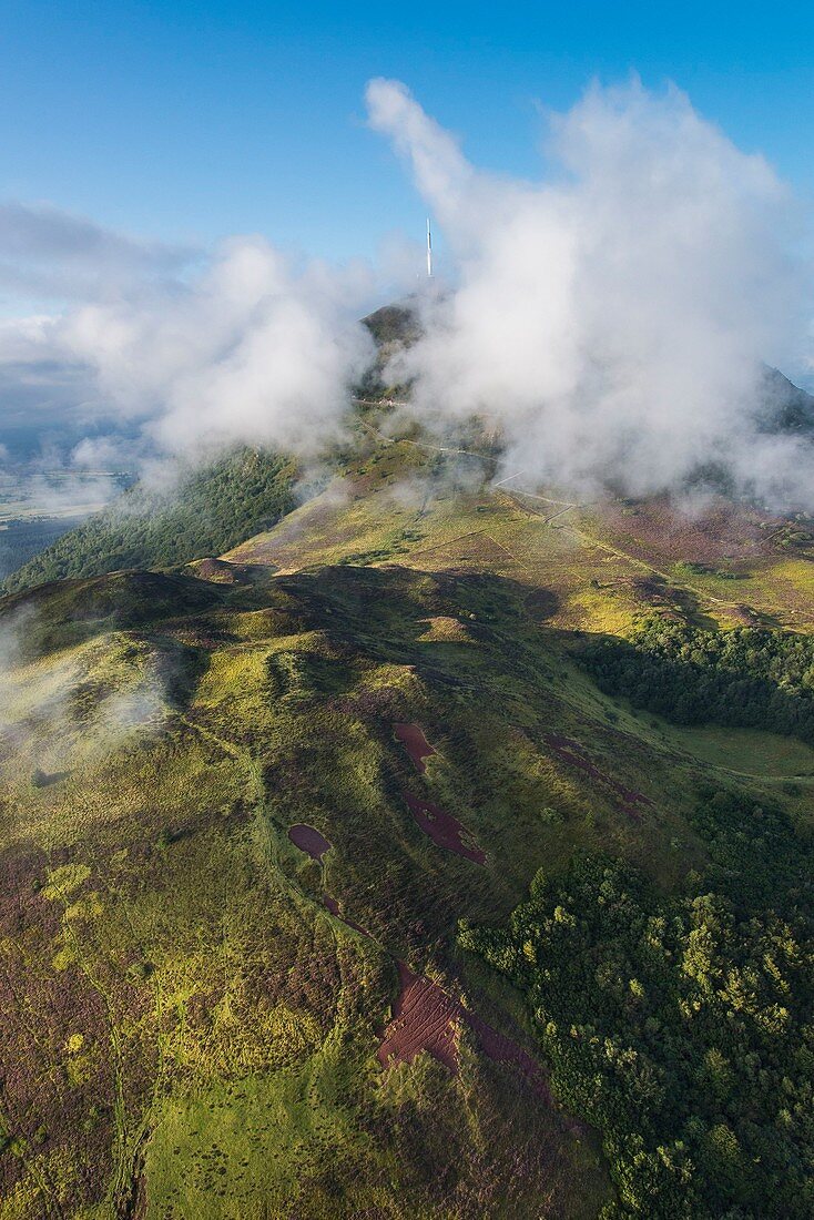 France, Puy de Dome, area listed as World Heritage by UNESCO, Orcines, Chaine des Puys, Regional Natural Park of the Auvergne Volcanoes, the Puy de Dome in the clouds (aerial view)