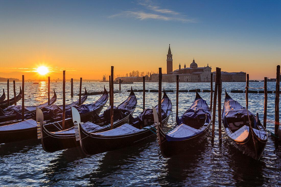 Venetian winter sunrise after snow with gondolas, San Giorgio Maggiore and Lido, Venice, UNESCO World Heritage Site, Veneto, Italy, Europe