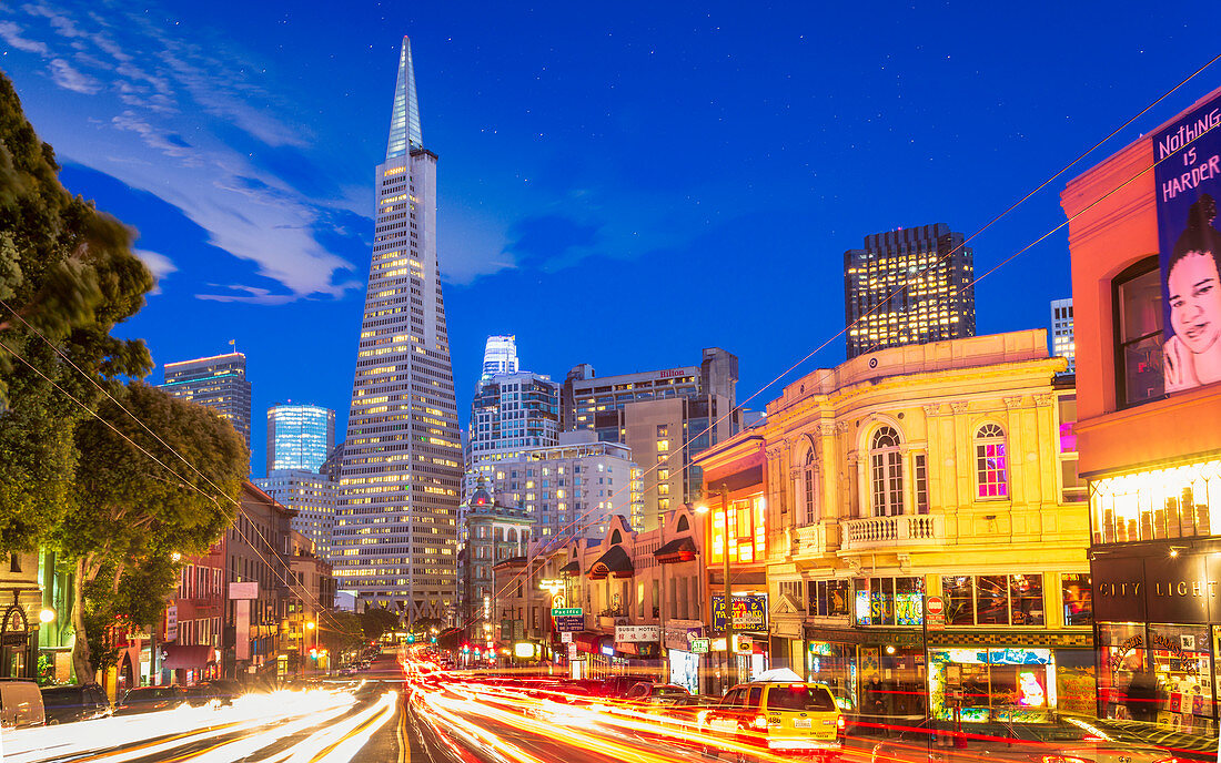 View of Transamerica Pyramid building on Columbus Avenue and car trail lights, San Francisco, California, United States of America, North America