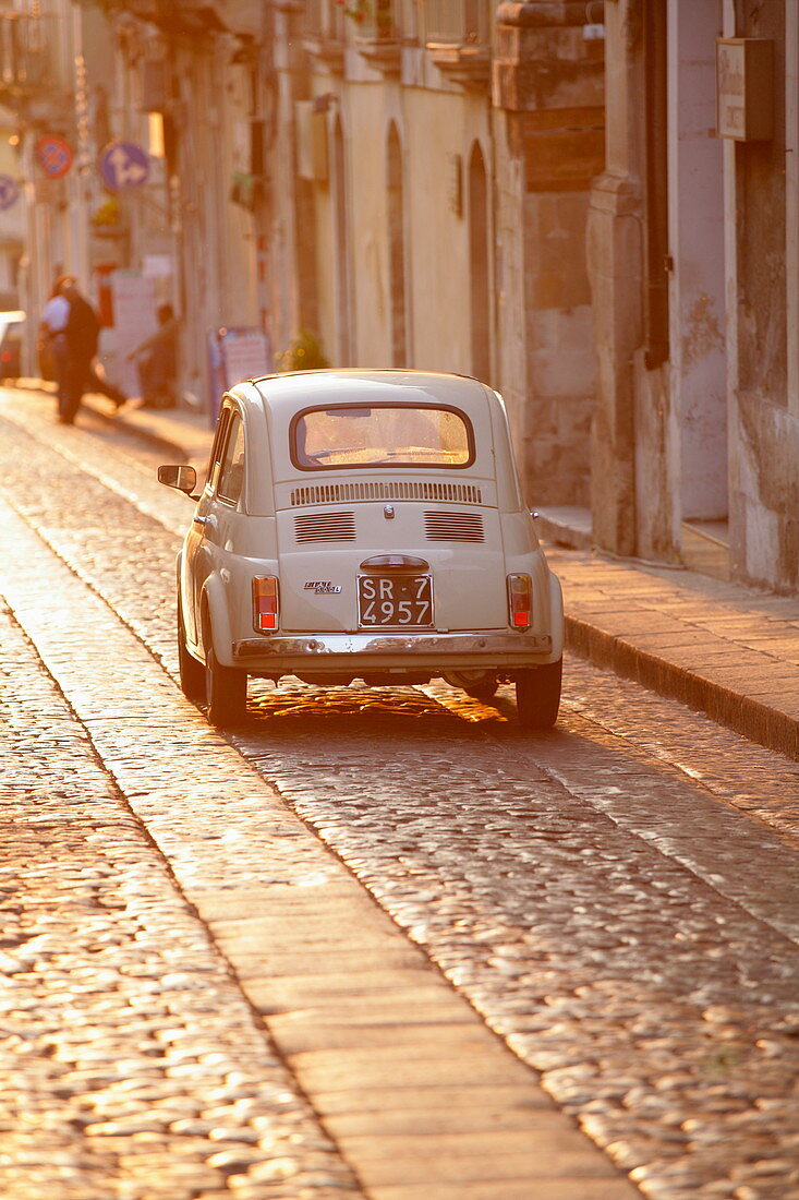 Fiat 500 driving down cobbled street, … – License image – 71319179 ❘ Image  Professionals